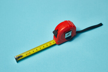 measuring tape on a blue background