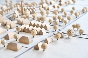 Architectural Model, miniature construction of a village out of houses in different shapes, traditional urban and rural planning - obrazy, fototapety, plakaty