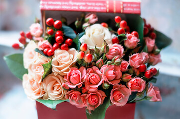 Nice bouquet with small roses in a box. Congratulation. card.