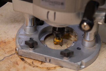 Closeup of wood router on a wooden table