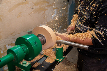 Carpenter turning wood on a lathe