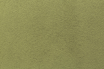 Sample of a texture of khaki plaster. Wall finished with a decorative cement stucco. Example of exterior building decoration. Clean uniform grainy background. Banner. Wallpaper. Copy space. Pattern