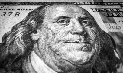 Benjamin Franklin portrait on USA dollar bill, macro view of one hundred US dollar note