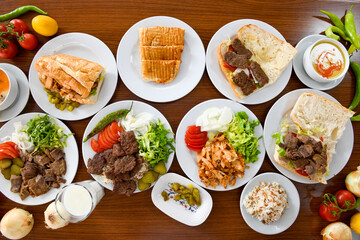 Table scene of assorted take out or delivery foods. Traditional Turkish cuisine. Various Turkish meal and appetizers. Top down view on a table.
