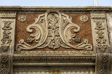 Close view of a traditional decorated front wall in the village of Fuseta, Algarve, Portugal