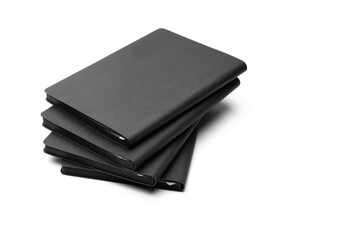 Stack of black blank notebook isolated on isolated white background. Mock up for branding.