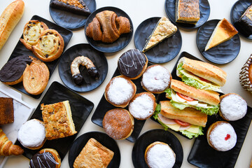 Traditional Turkish cuisine. Pizza, pita, pidesi, sucuk, hummus, kebab. Many dishes on the table. Serving dishes in restaurant. Background image. Top view, flat lay