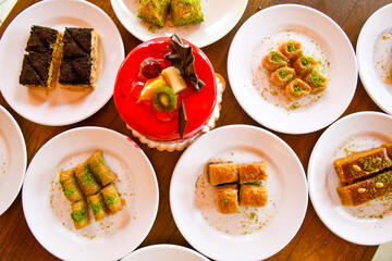 Traditional Turkish cuisine. Pizza, pita, pidesi, sucuk, hummus, kebab. Many dishes on the table. Serving dishes in restaurant. Background image. Top view, flat lay