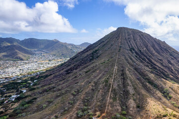 Aerial drone view of Koko Head Crater, it's railroad trail directly to the peak, and the botanical...
