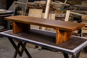 Fototapeta na wymiar Newly-made brown wooden table in the workshop
