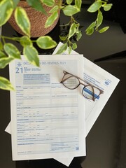 Tax return with glasses, France 2022