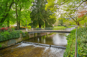 Fototapeta na wymiar The river Oos in the spa gardens of Baden Baden. Baden Wuerttemberg, Germany, Europe
