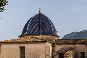 Dome in mediterranean style, with blue roof tliles.