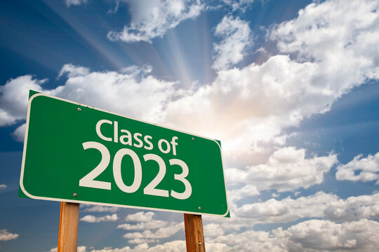Class of 2023 Green Road Sign with Dramatic Clouds and Sky
