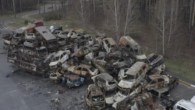 Irpin, Ukraine: Evidance of Russian war crimes. A large number of shot and destroyed civil cars at the car graveyard in Irpin, Ukraine. Aerial view