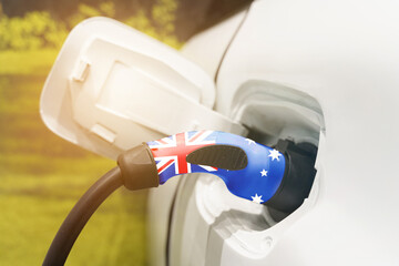 Charging an electric vehicle with an electric cable with an image of the Australian flag