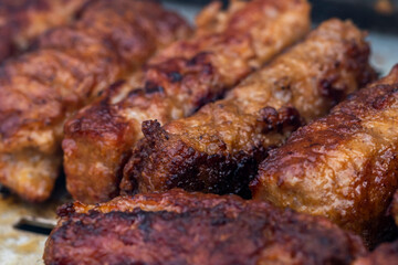 Traditional Romanian food called "mici" which consist of pork meat rolls