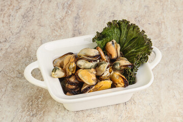 Tasty marinated mussels in the bowl