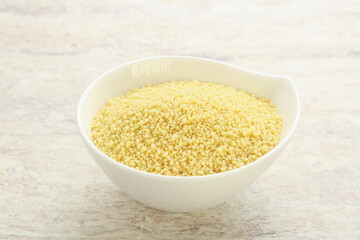 Raw couscous in the bowl