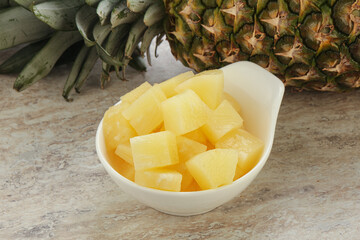Marinated pineapple slices in the bowl