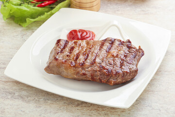 Grilled rib-eye steak beef meat