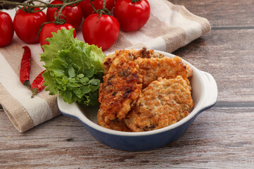 Fried salmonn cutlet in the bowl