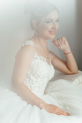 Fototapeta na wymiar Portrait of a smiling bride on the sofa