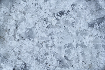 Fototapeta na wymiar crystals rock salt cubes macro under the microscope granules