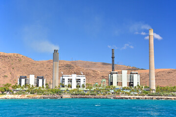 Fototapeta premium Power plant at Kahe Point Beach Park aka Electric beach on the southwest side of Oahu Island in Hawaii