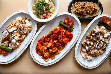 Table scene of assorted take out or delivery foods. Traditional Turkish cuisine. Various Turkish meal and appetizers. Top down view on a table.