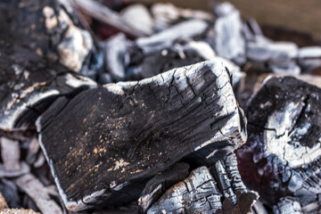 Close up shot of burning wood and charcoal used for barbeque
