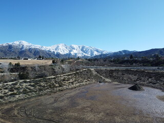 A Water Catch basin to Help Run-Off Percolate into the Ground to Recharge the Aquifer with Snow Capped Mountains in the background