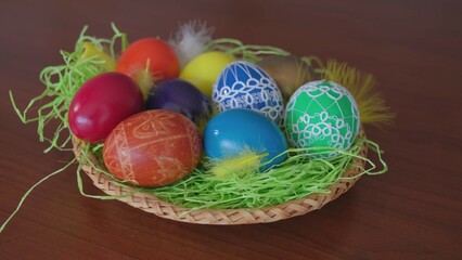 Table Basket With Colorful Painted Eggs Decorated with Handmade Traditional Polish Ornaments for Easter Holidays