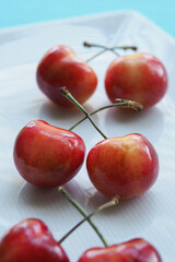 Bunch of Sweet Cherries on White Plate, White Background