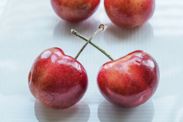 Lovely Sweet Cherries on White Plate, White Background