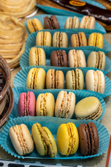 Fresh baked sweet macarons cookies with cream in French bakery