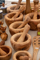 Craft works, olive tree wooden kitchen utensils on farmers market in Provence, France