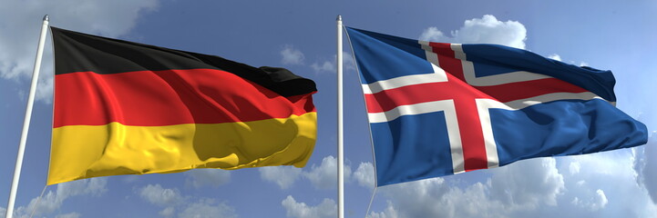 Flying flags of Germany and Iceland on high flagpoles. 3d rendering