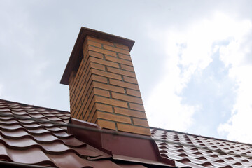 Chimney on of roofing materials corrugated red metal roof tile sheets