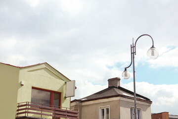 Beautiful street lamp with glass globes outdoors