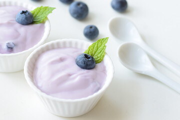 Blueberry Yogurt with Fresh Blueberries and Mint, White Background