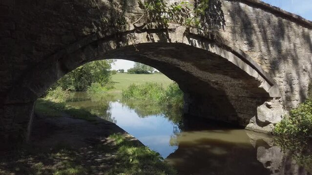 Reflections under a bridge on the Oxford Canal