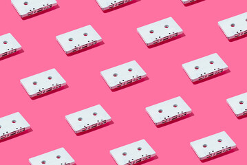 Trendy sunlight Summer pattern made with Painted retro white cassette tape on pink bright background. Minimal creative layout on vibrant color.