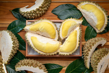 Durian fruit on wooden background, Durian fruit with delicious golden yellow skin with soft sweet and fragrant.