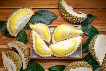 Durian fruit on wooden background, Durian fruit with delicious golden yellow skin with soft sweet and fragrant.