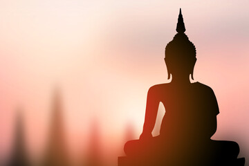 big buddha silhouette sunset background