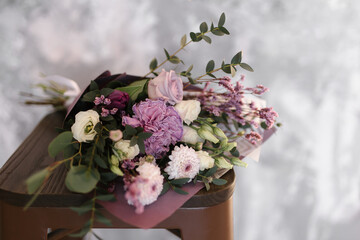 Bright bouquet with tulips, carnations, roses, chrysanthemum in space style