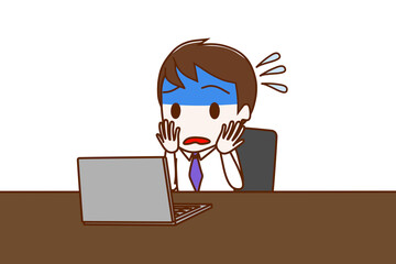 パソコン作業でトラブルにあって青ざめて焦っている男性