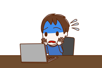 パソコン作業でトラブルにあって青ざめて焦っている少年