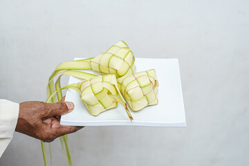 Glutinous rice wrapped in leaves. Also known as Ketupat Palas. Served on Eid al-Fitr by Muslims in...